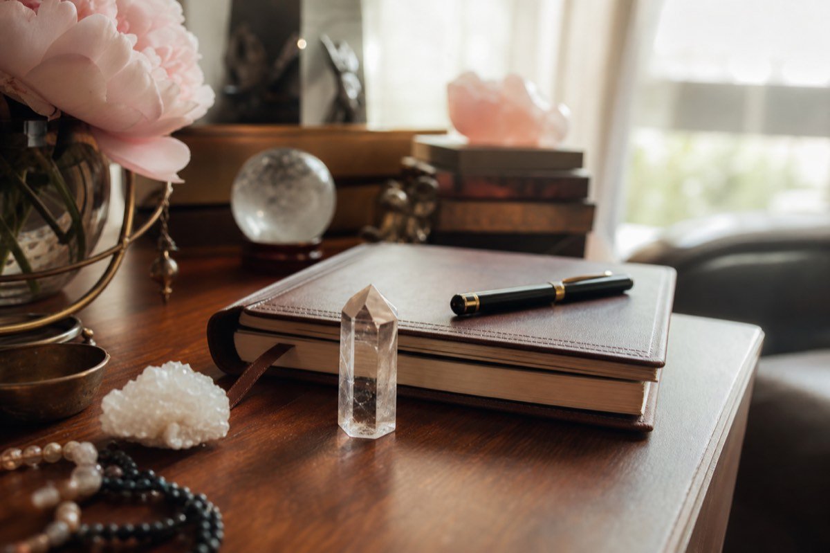 Notebook and crystal on a desk for career psychic readings